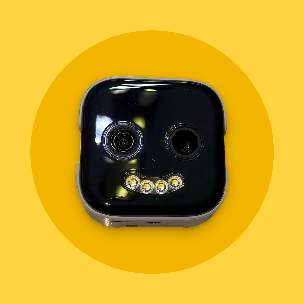 SmileCam window security camera with its LED smile lit